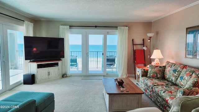 living room featuring ornamental molding, light carpet, and a textured ceiling