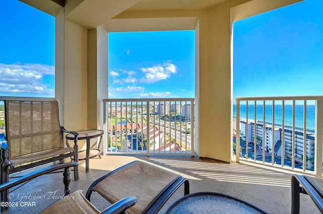 balcony featuring a water view