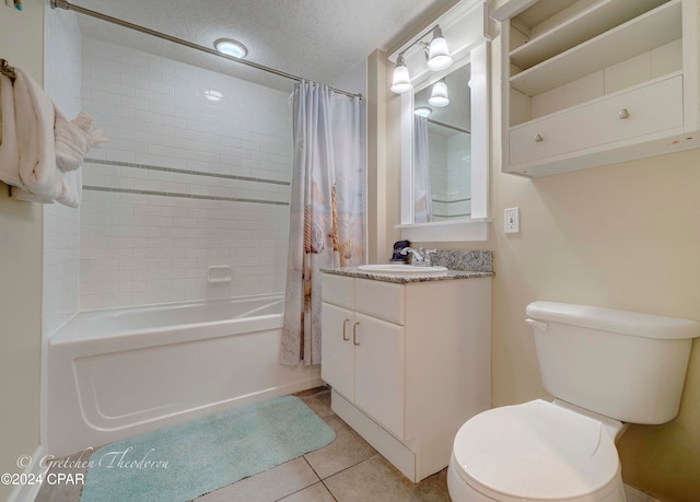 full bathroom with shower / bath combo, a textured ceiling, vanity, tile patterned flooring, and toilet