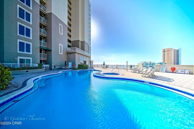 view of swimming pool featuring a patio area