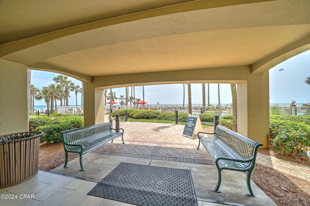 view of patio with a water view