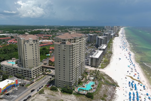 birds eye view of property with a view of the beach and a water view