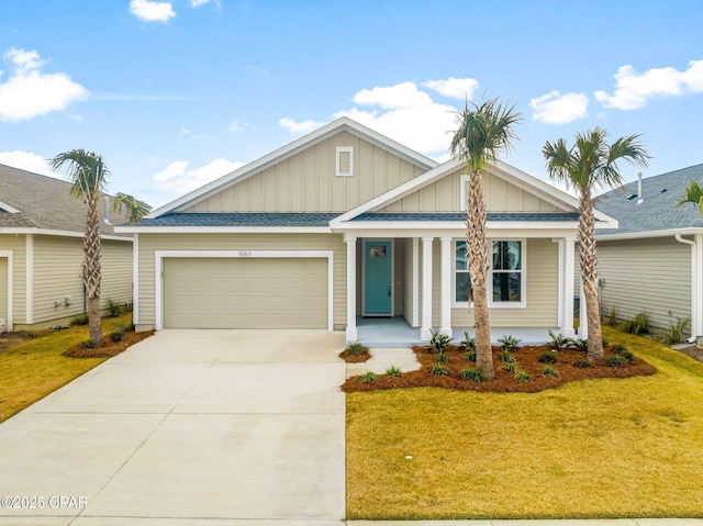 view of front of home featuring a garage and a front lawn