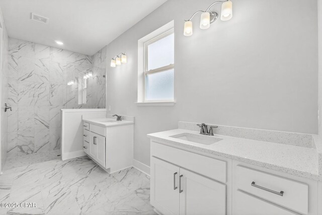 kitchen featuring decorative light fixtures, white cabinetry, sink, a center island, and stainless steel dishwasher