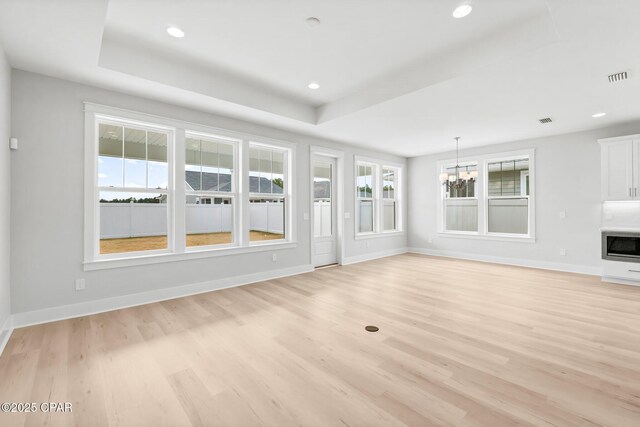 spacious closet with washing machine and clothes dryer and light wood-type flooring