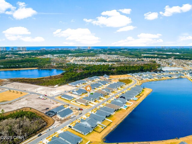 birds eye view of property with a water view