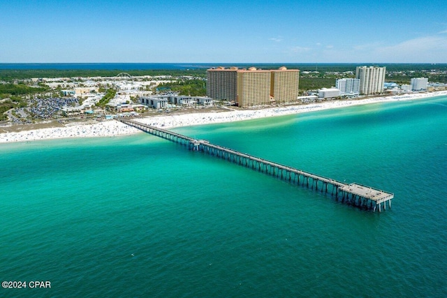 aerial view with a water view and a beach view