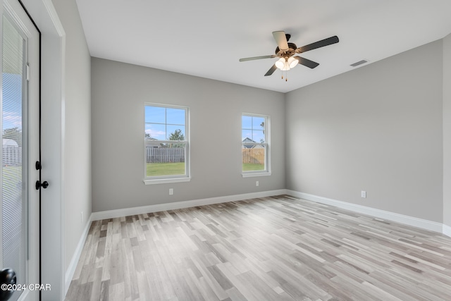 empty room with light hardwood / wood-style floors and ceiling fan