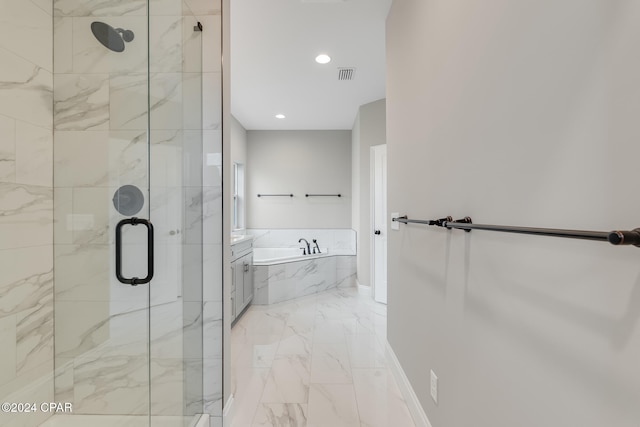 bathroom featuring independent shower and bath