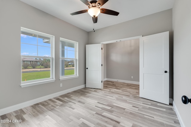 unfurnished bedroom with light hardwood / wood-style floors and ceiling fan