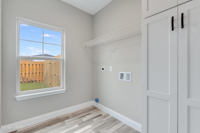 laundry room with hookup for an electric dryer, light wood-type flooring, and washer hookup