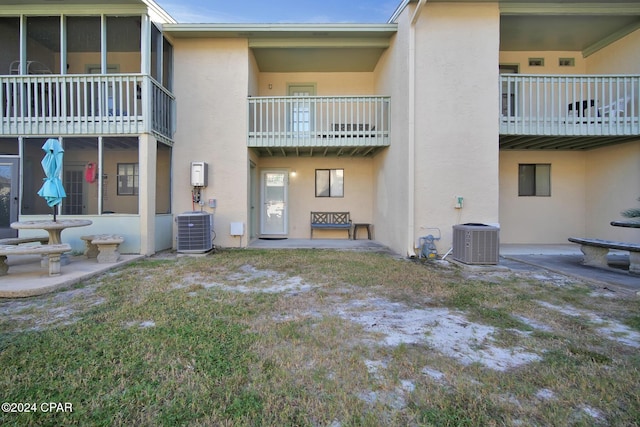 rear view of house with central AC