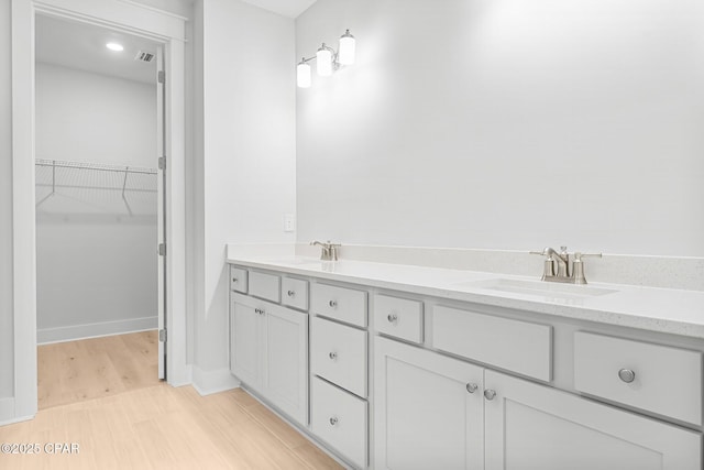 bathroom featuring vanity and hardwood / wood-style floors