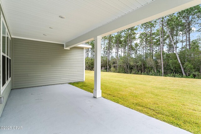 back of house featuring a patio and a lawn