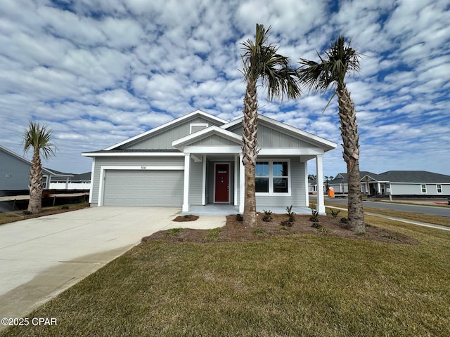 view of front of home featuring a front yard and a garage