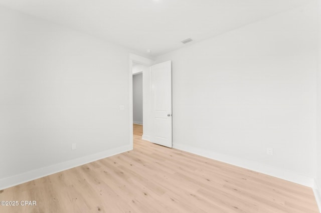 unfurnished room with light hardwood / wood-style flooring