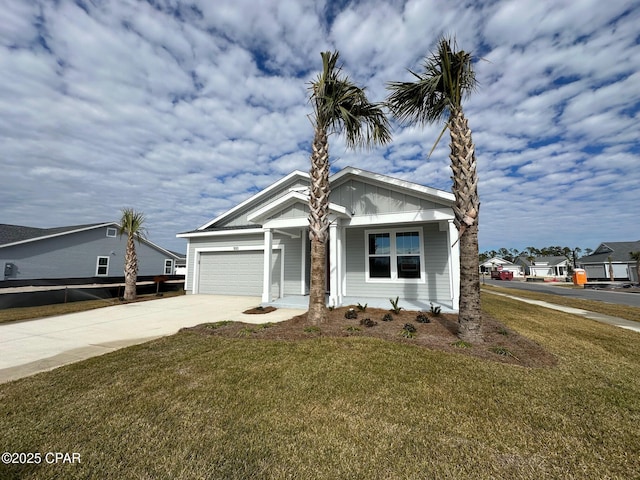 view of front of house with a garage and a front lawn