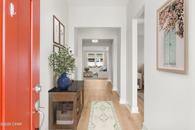 hall with light hardwood / wood-style floors