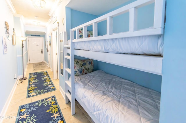 tiled bedroom with ornamental molding