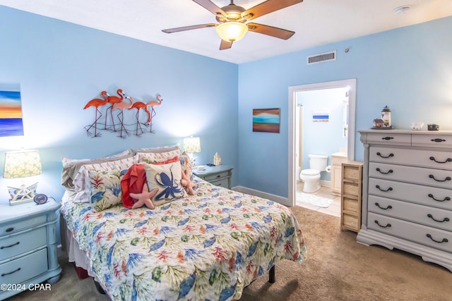 bedroom with connected bathroom, ceiling fan, and carpet