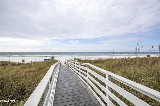 view of property's community featuring a view of the beach and a water view