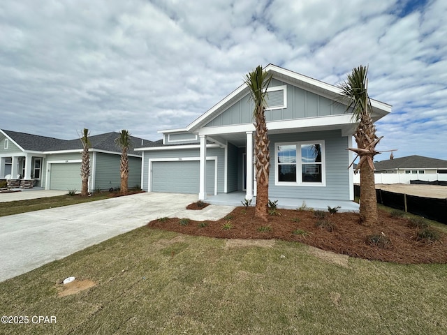 view of front of house with a front lawn and a garage