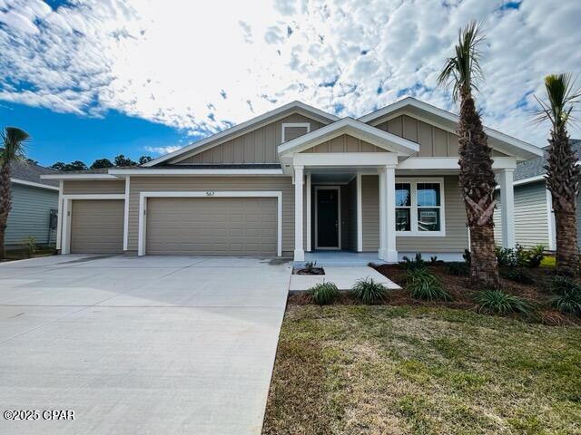 view of front of house with a garage and a front yard