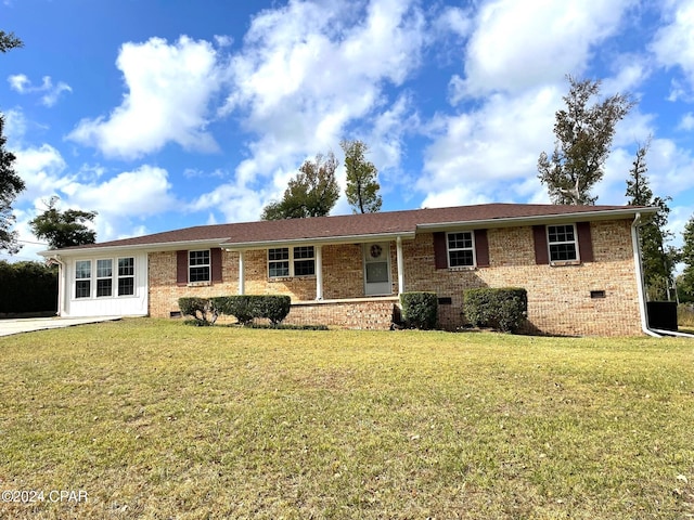 ranch-style house with a front yard