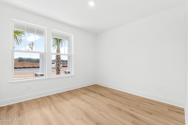 unfurnished room featuring light hardwood / wood-style floors