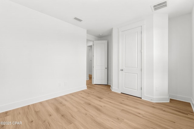 unfurnished bedroom with light wood-type flooring