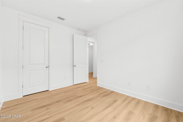 unfurnished bedroom featuring light hardwood / wood-style floors