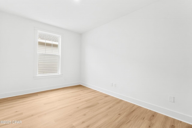 spare room featuring light hardwood / wood-style flooring