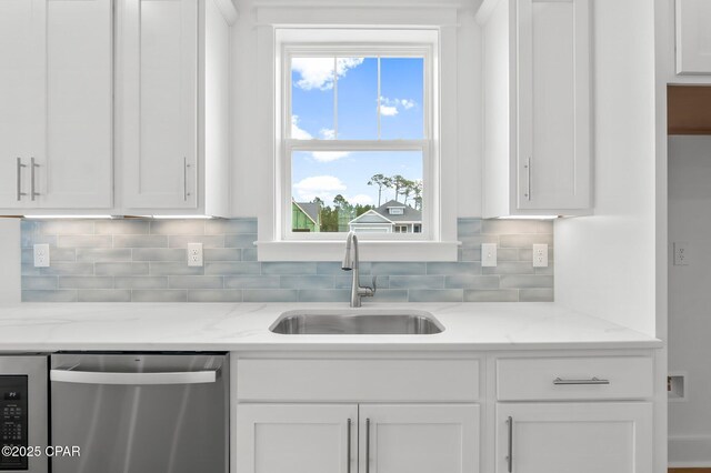 kitchen featuring white cabinetry, appliances with stainless steel finishes, and sink