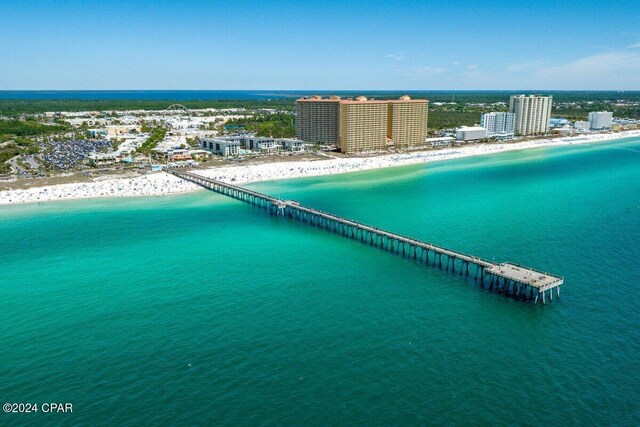 bird's eye view with a view of the beach and a water view