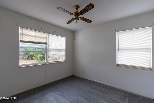 unfurnished room with carpet and ceiling fan