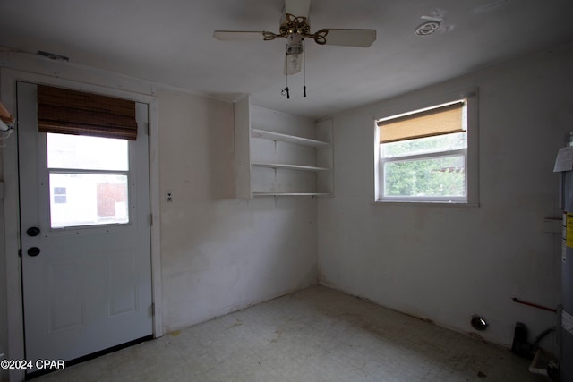 interior space featuring ceiling fan and a healthy amount of sunlight