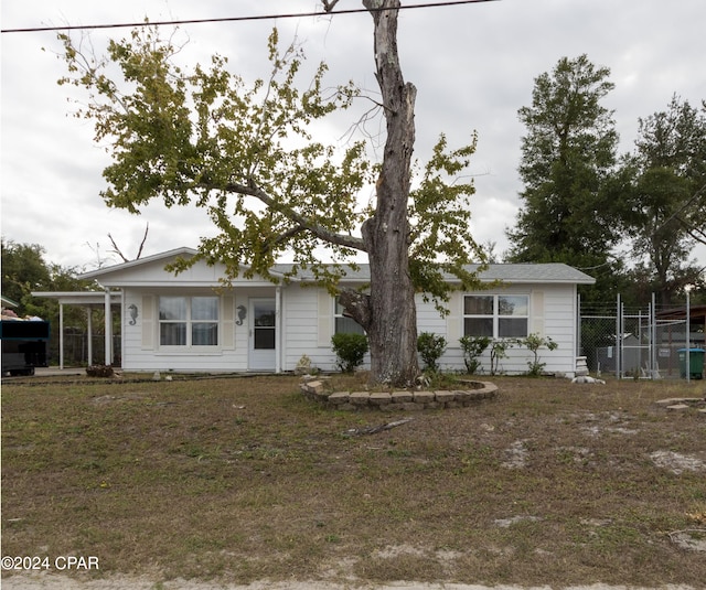 view of front of home featuring a carport