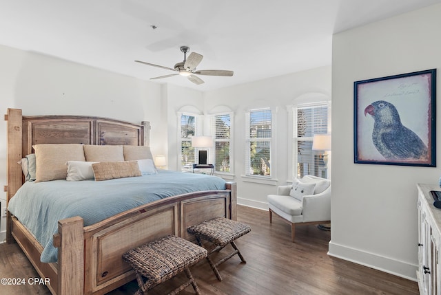 bedroom featuring dark hardwood / wood-style flooring and ceiling fan