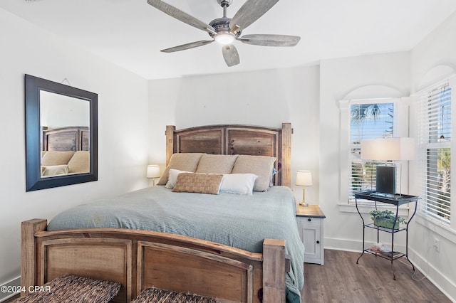 bedroom with hardwood / wood-style flooring and ceiling fan