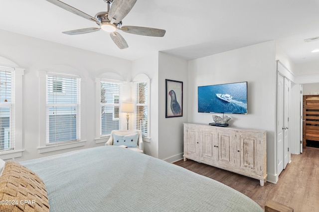 bedroom featuring hardwood / wood-style flooring and ceiling fan