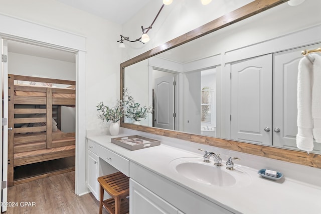 bathroom featuring hardwood / wood-style floors and vanity