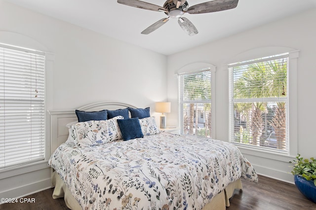 bedroom featuring ceiling fan and dark hardwood / wood-style flooring