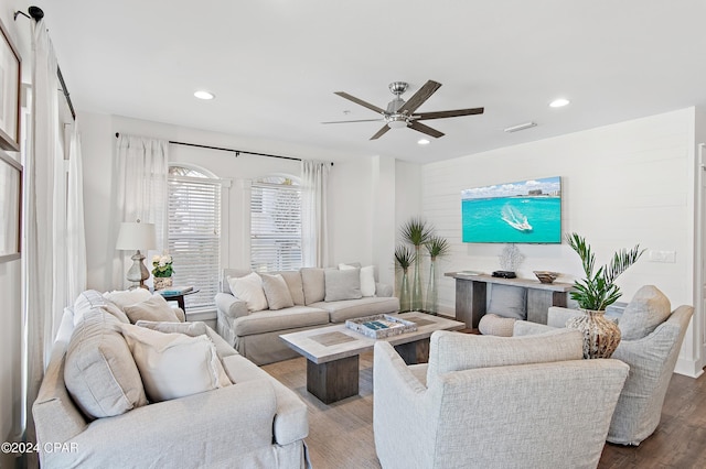 living room with ceiling fan and wood-type flooring