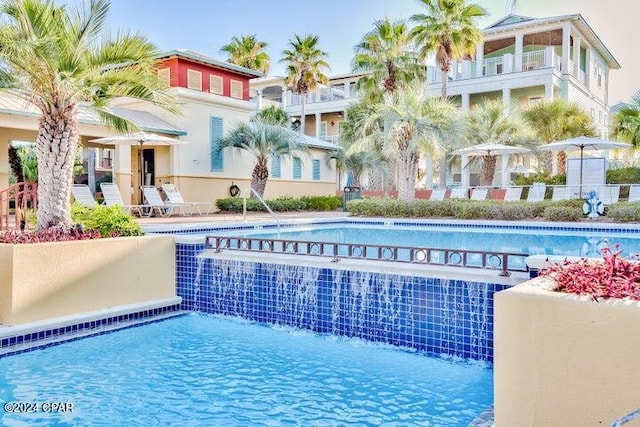 view of pool featuring pool water feature