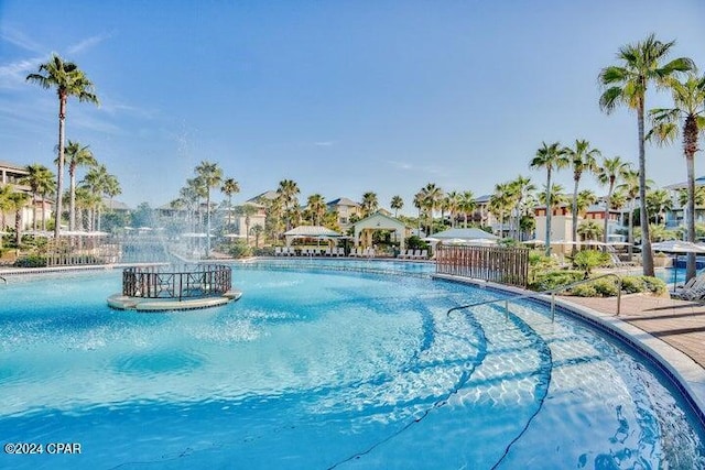 view of swimming pool featuring pool water feature