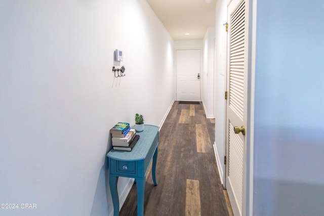 corridor with dark hardwood / wood-style floors