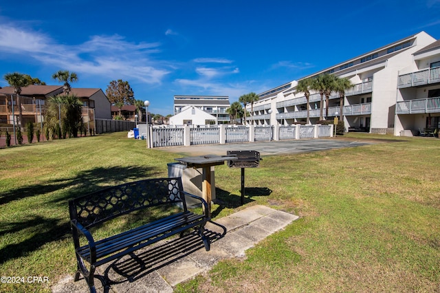 view of property's community with a yard