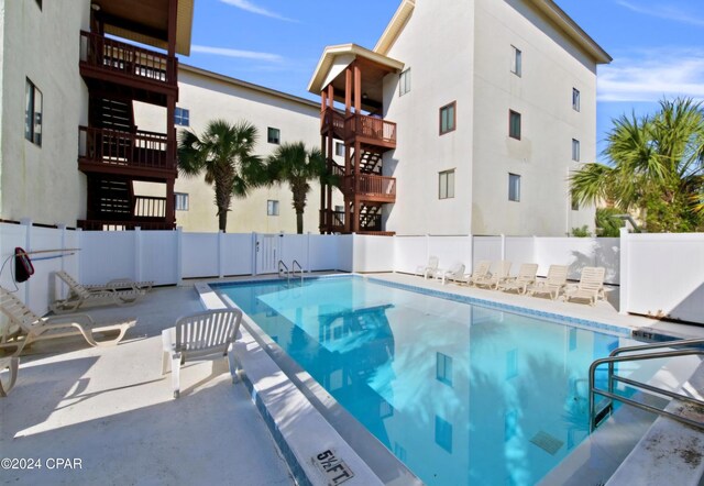 view of pool featuring a patio