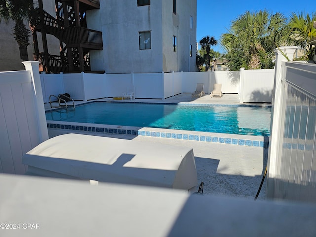 view of pool featuring a patio