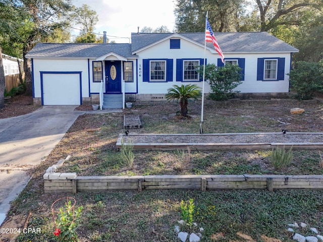 ranch-style house featuring a garage